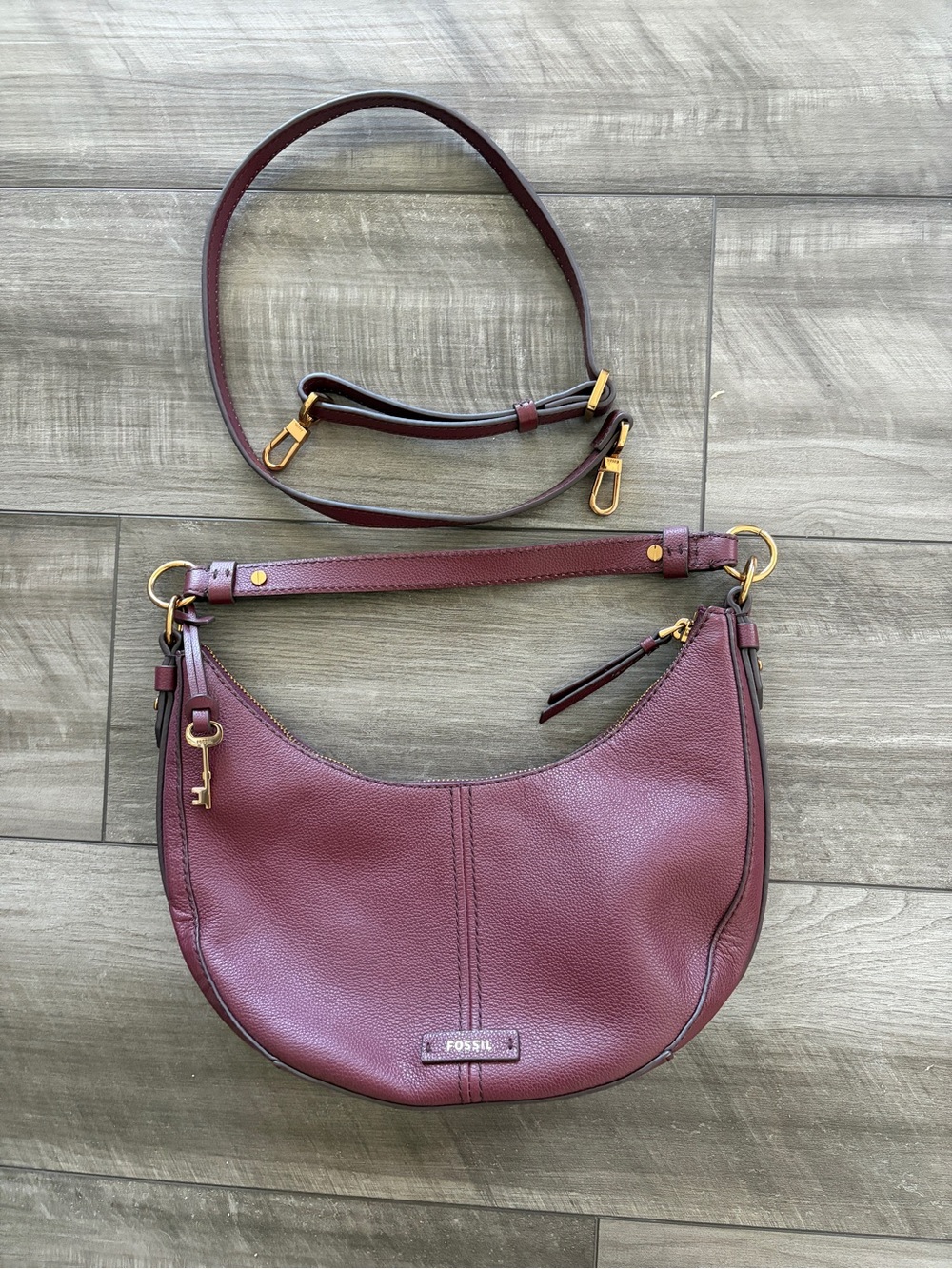 Fossil Women's Leather Crossbody Bag in Burgundy with gold hardware.
